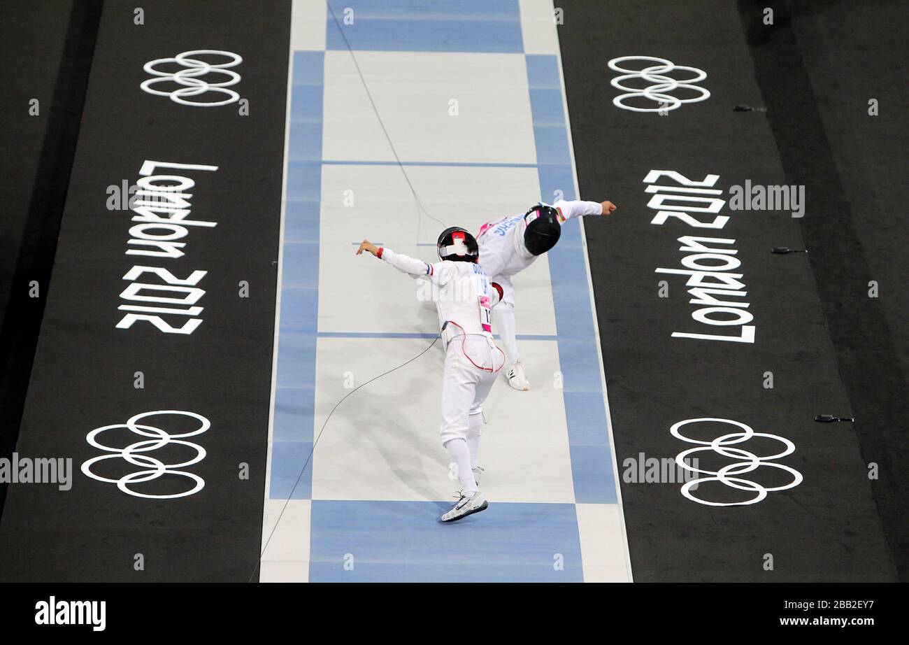 Chile's Esteban Bustos (near) competes against Lithuania's Justinas Kinderis in the Modern Pentathlon at the Copper Box during day 15 of the London 2012 Olympics Stock Photo