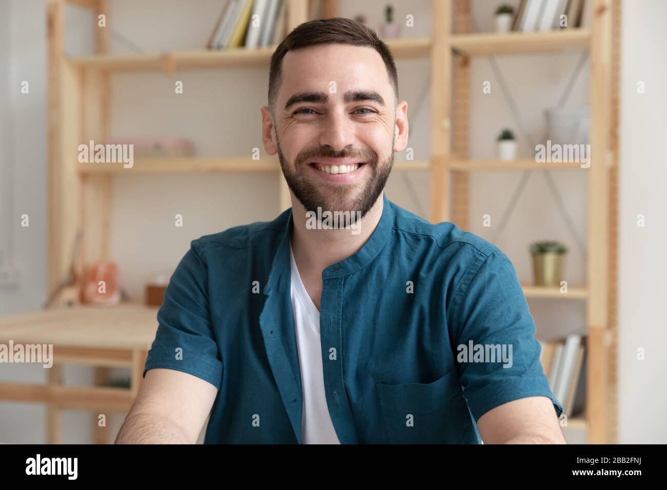 Portrait of confident Caucasian male employee in office Stock Photo