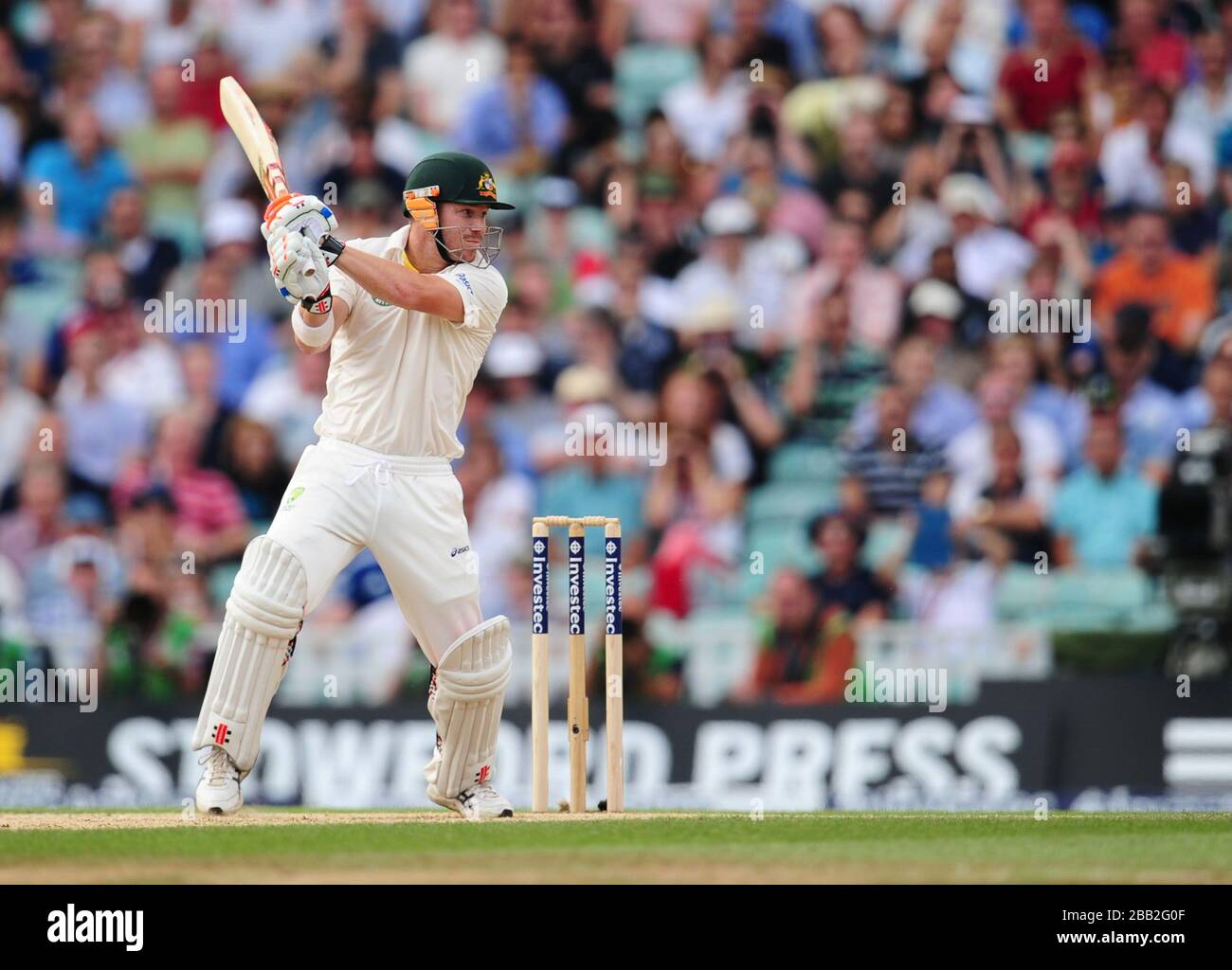 Australia's David Warner hits four runs during day five of the Fifth Investec Ashes Test match at The Kia Oval, London. Stock Photo