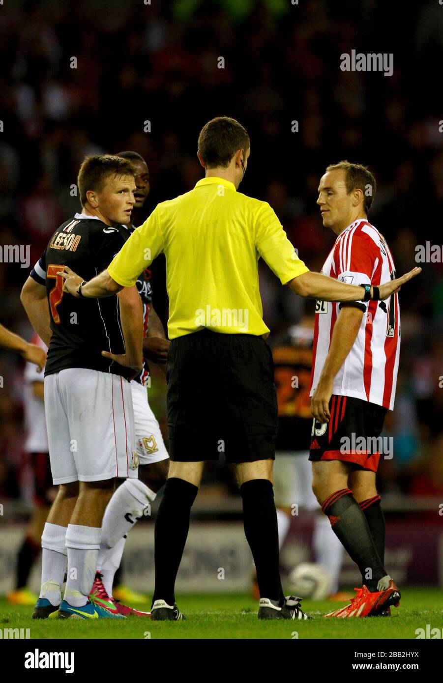 Referee David Coote Separates Sunderland's David Vaughan (right) And MK ...