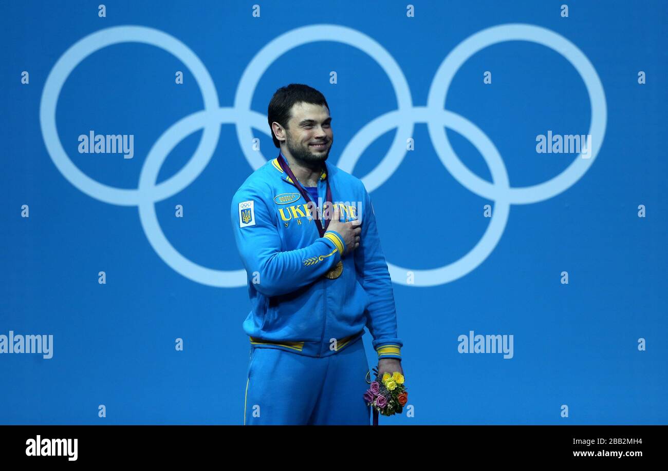 Ukraine weightlifter Oleksiy Torokhtiy celebrates winning the Olympic