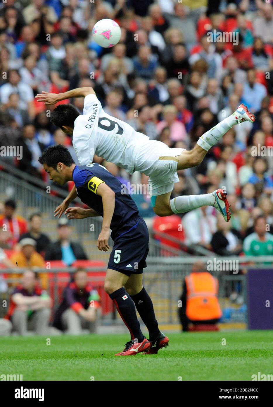 Japan's Maya Yoshida and Mexico's Oribe Peralta, during the Men's Football Semi-final at Wembley Stadium. Stock Photo