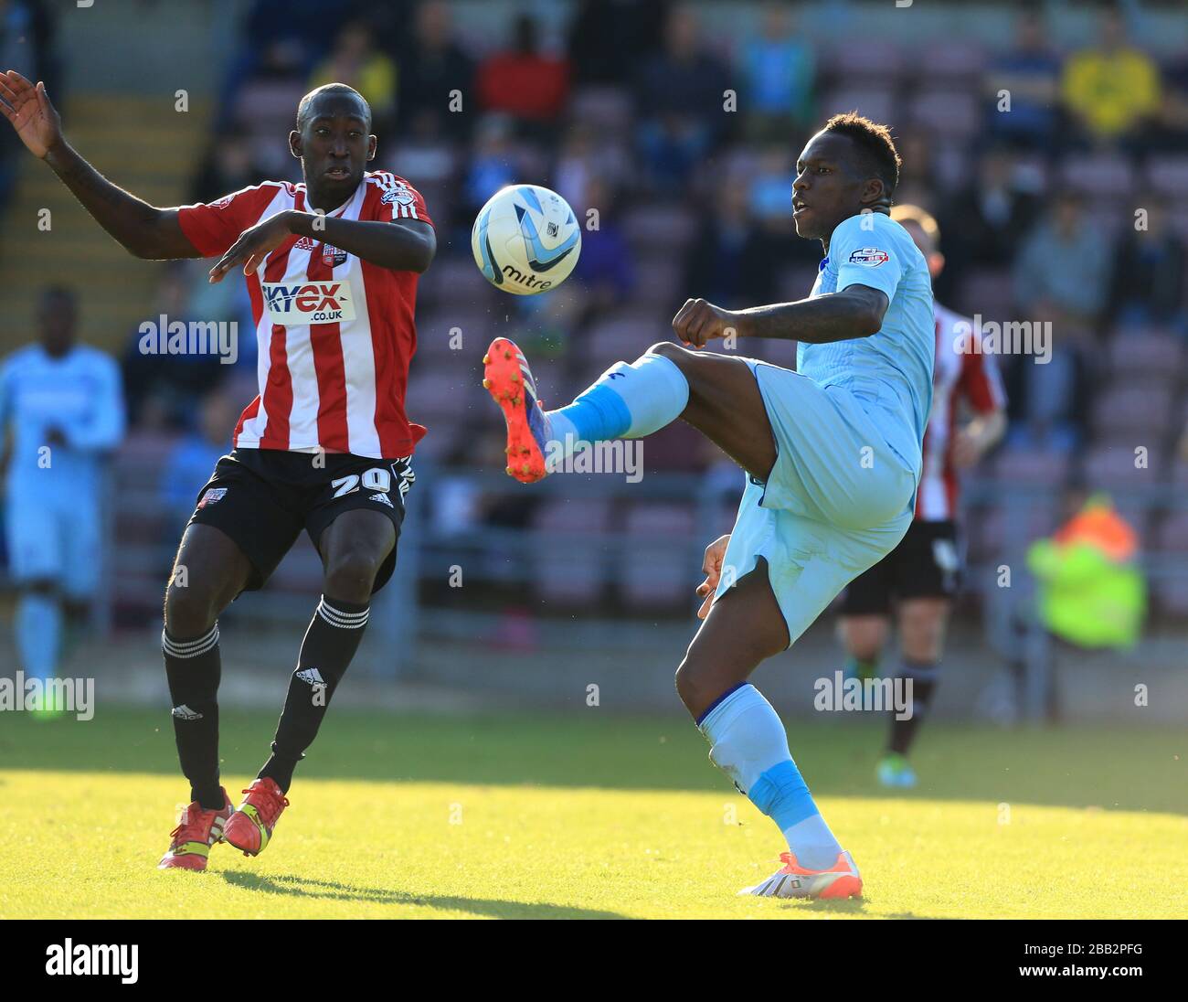 Brentford's Toumani Diagouraga (left) and Coventry City's Mathieu ...