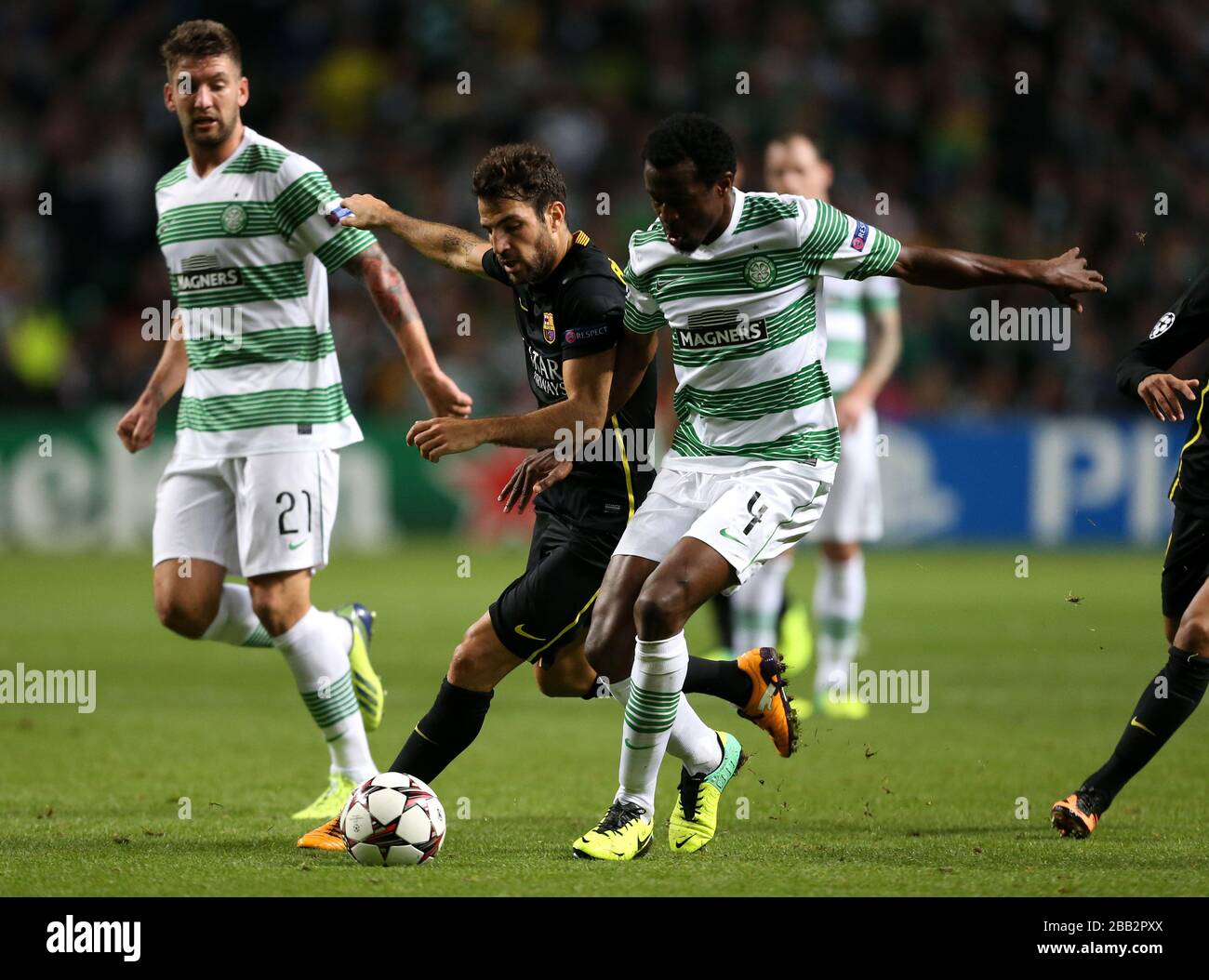 Celtic's Efe Ambrose and Barcelona's Cesc Fabregas Stock Photo