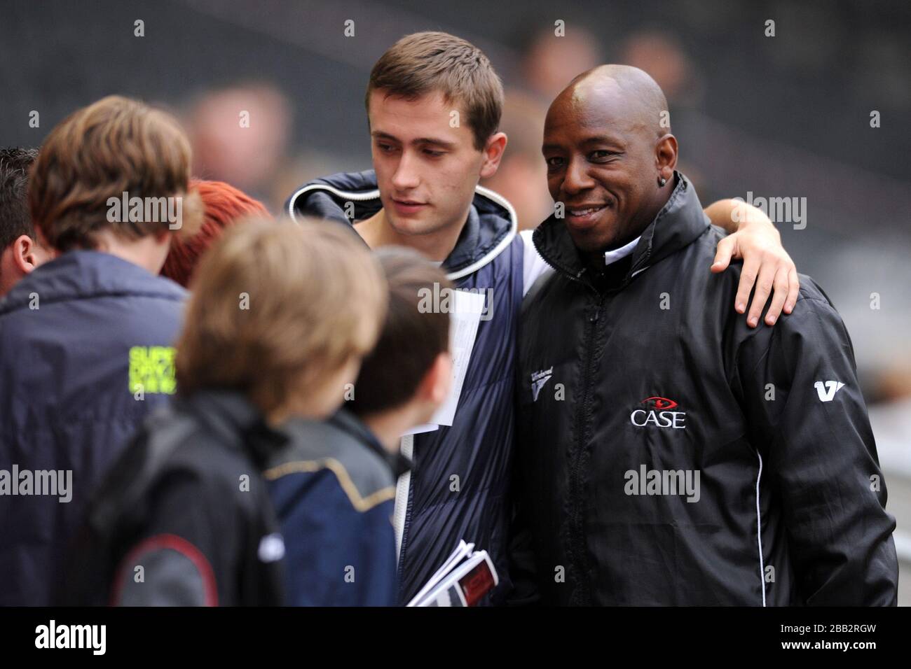 Milton Keynes Dons' First team Coach Ian Wright signs autographs for