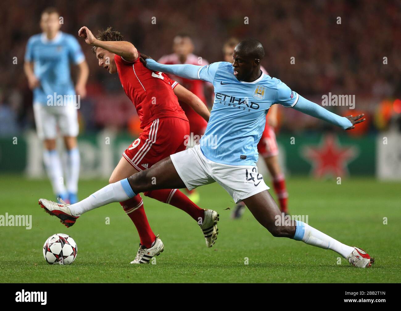 Manchester City's Yaya Toure (right) and Bayern Munich's Toni Kroos in action Stock Photo
