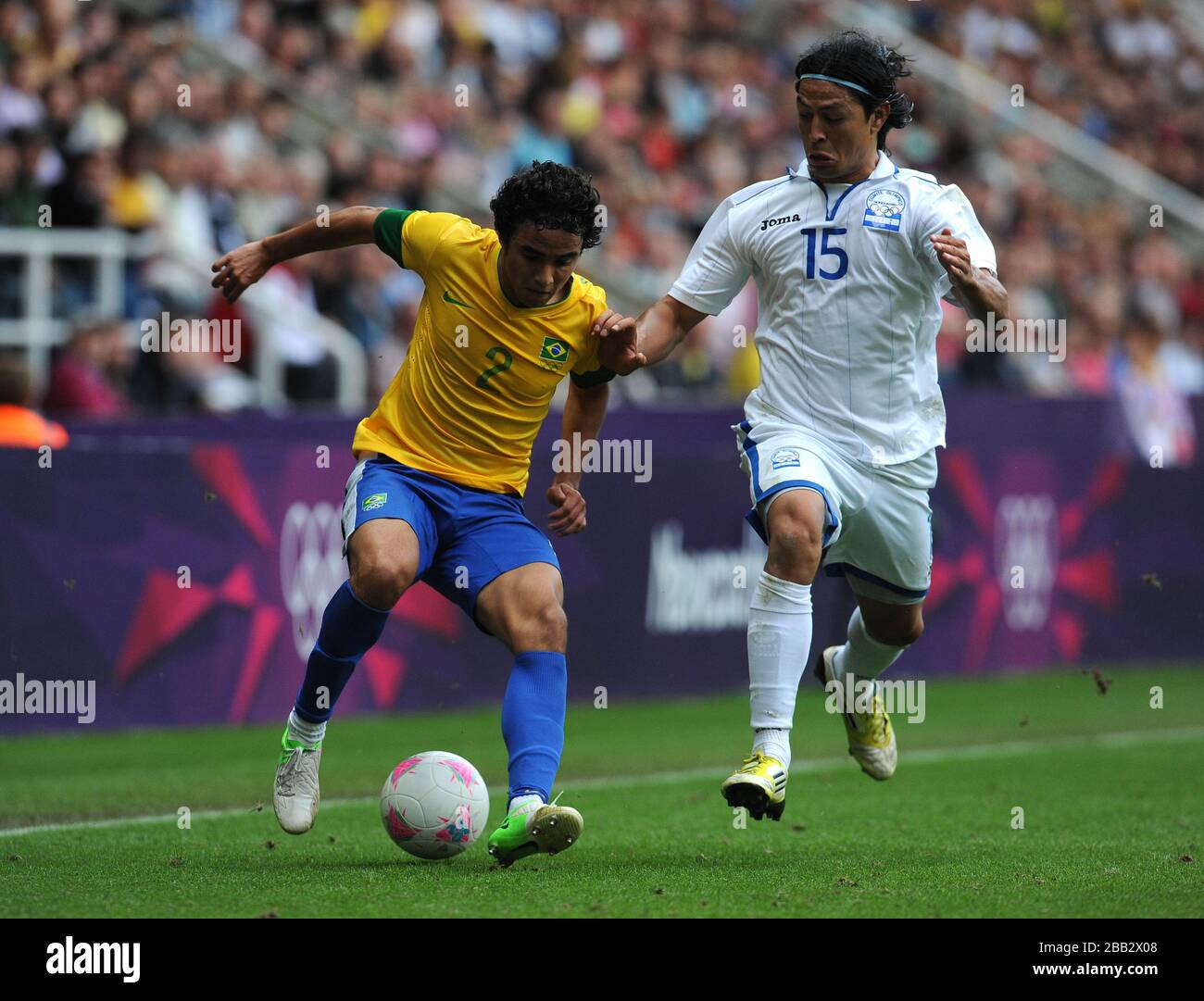 Brazil's Rafael (left) and Honduras' Roger Espinoza battle for the ball during the Men's Quarter final match at St James Park, Newcastle. Stock Photo