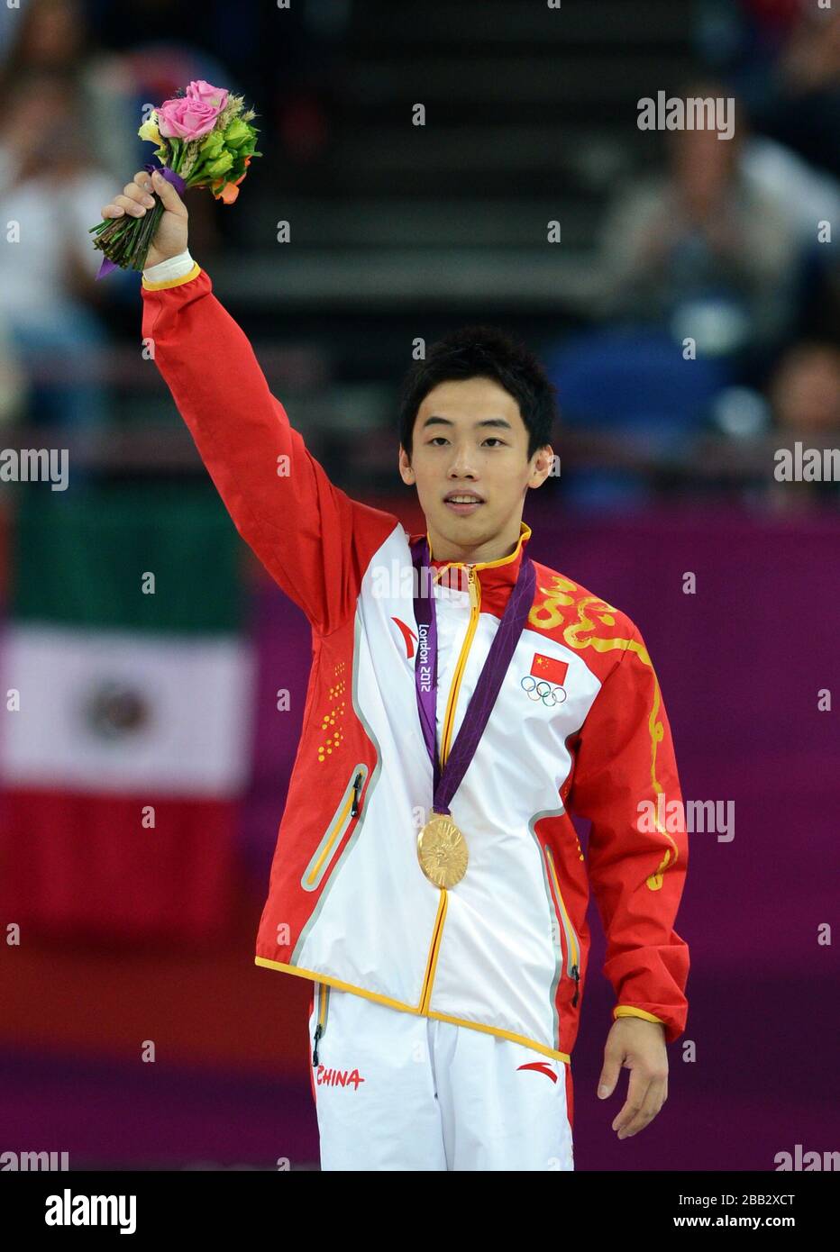China's Kai Zou celebrates winning gold the Artistic Gymnastics men's ...