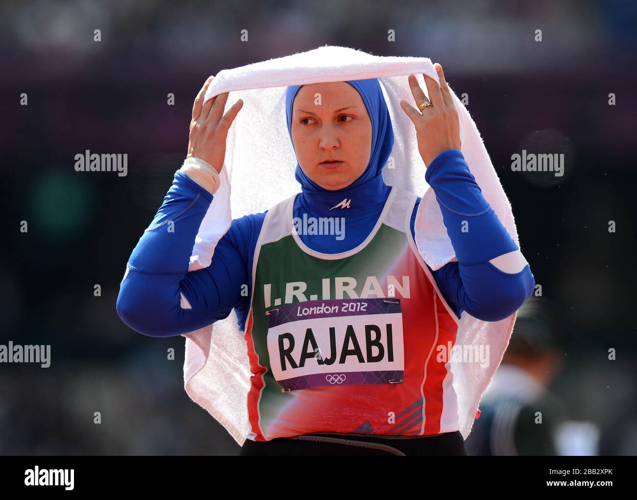 Leyla Rabjabi shelters from the sun during the Women's Shot put