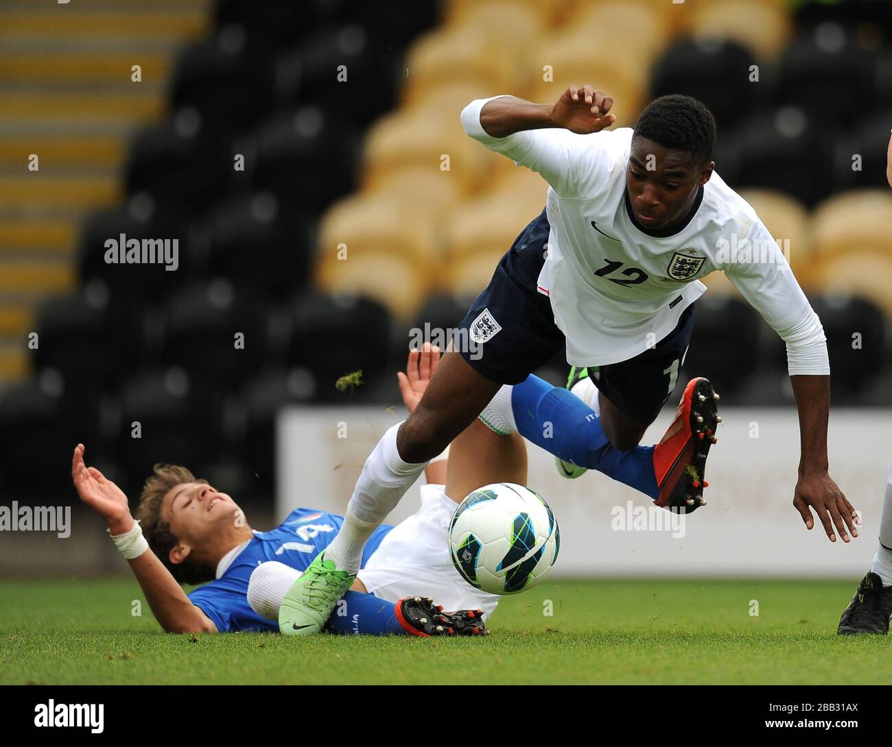 England's Mandela Egbo is tackled by Italy's Manuel Locatelli (left). Stock Photo