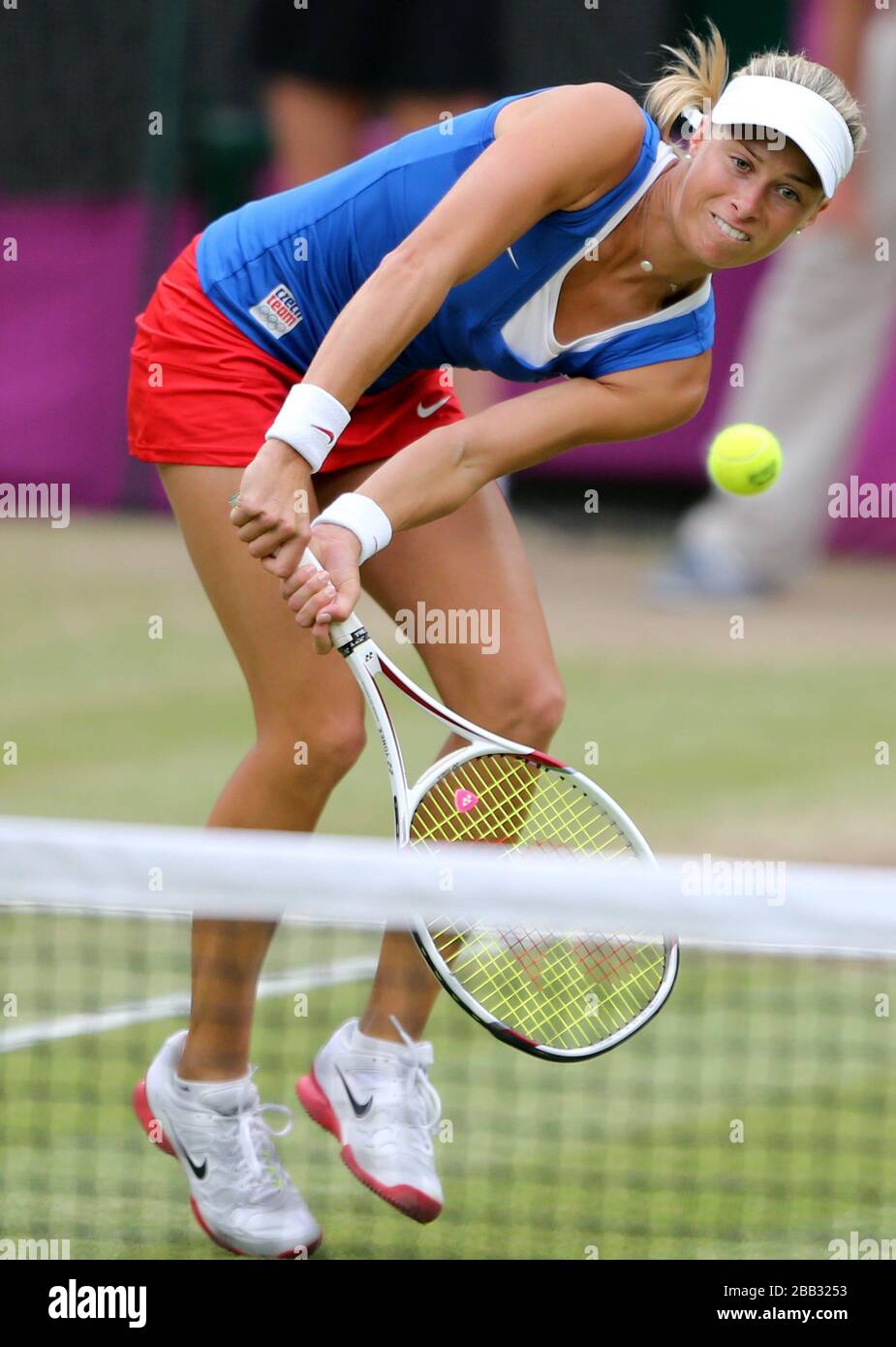 Women's tennis doubles players  Andrea Hlavackova  of the Czech Republic in action in the final against Serena and Venus Williams  at Wimbledon at the London 2012 Olympics Stock Photo