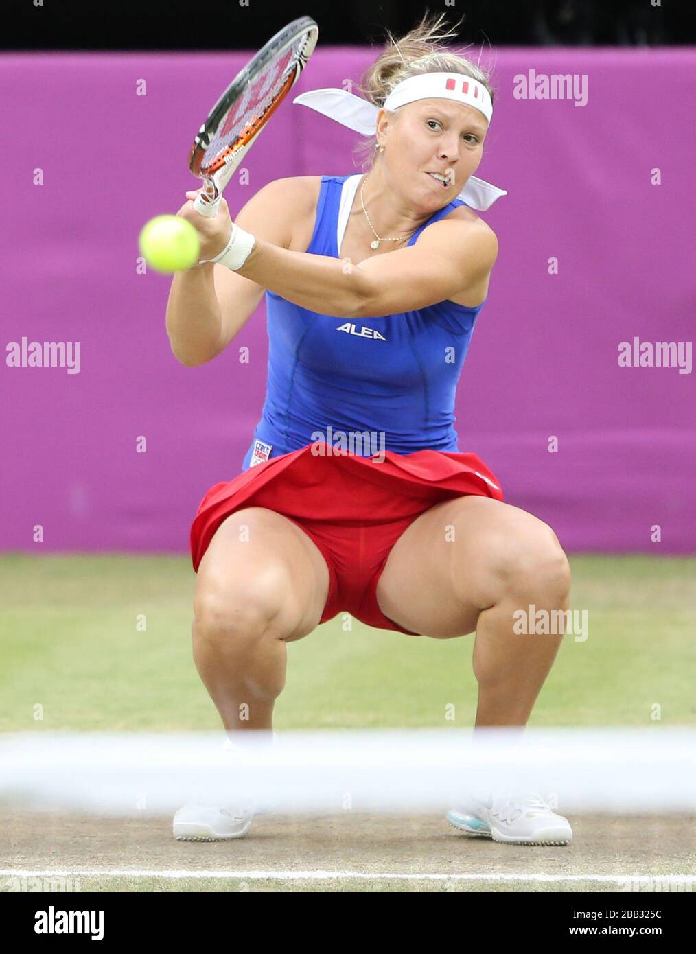 Women's tennis doubles player  Lucie Hradecka of the Czech Republic in action in the final against Serena and Venus Williams  at Wimbledon at the London 2012 Olympics Stock Photo