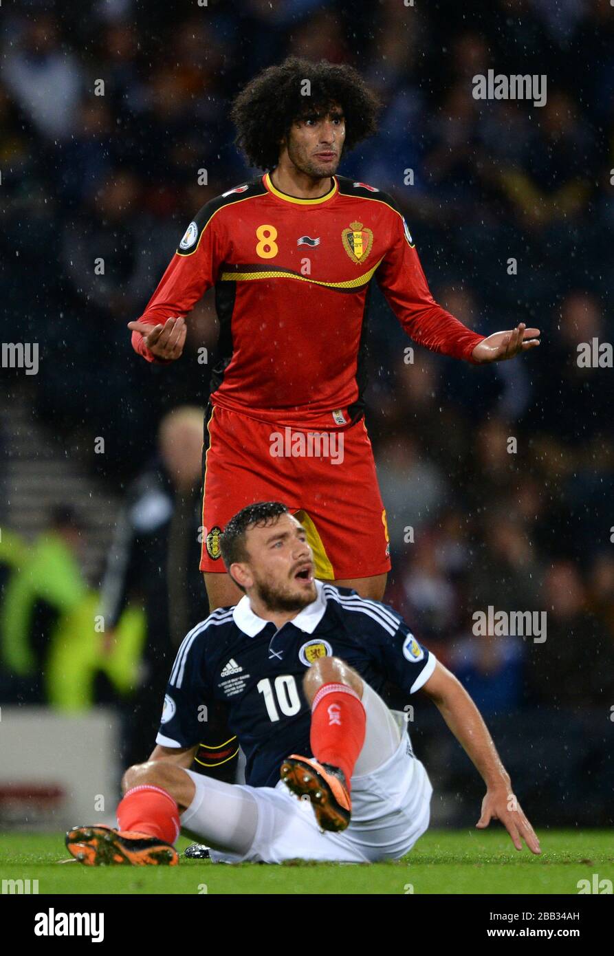 Belgium's Marouane Fellaini reacts after being booked for a foul on Scotland's Robert Snodgrass. Stock Photo