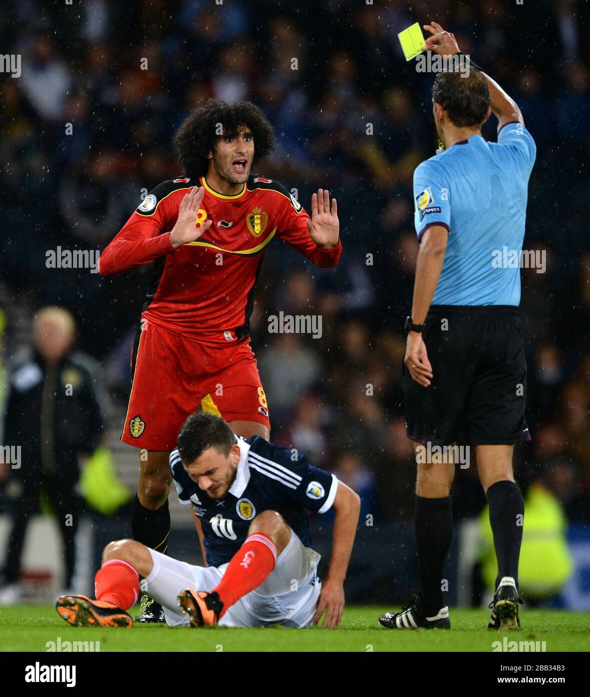 Belgium's Marouane Fellaini reacts after being booked for a foul on Scotland's Robert Snodgrass. Stock Photo
