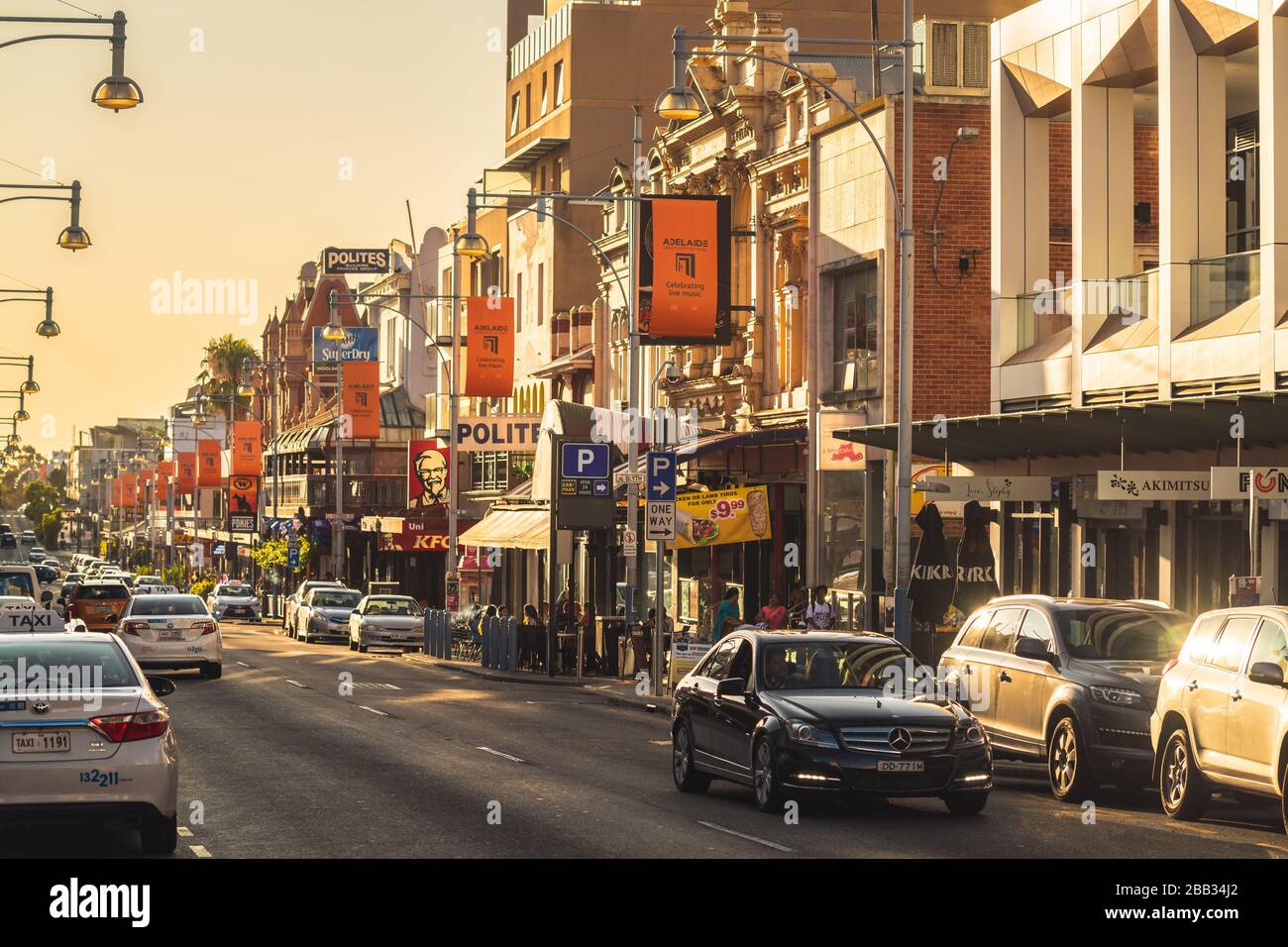 Adelaide, Australia - January 26, 2020: Hindley Street with bars, cafes and restaurants in Adelaide CBD looking west at sunset Stock Photo