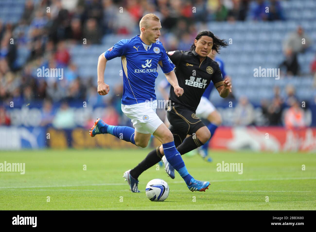 Leicester City's Ritchie De Laet (left) gets away from Wigan Athletic's Roger Espinoza Stock Photo