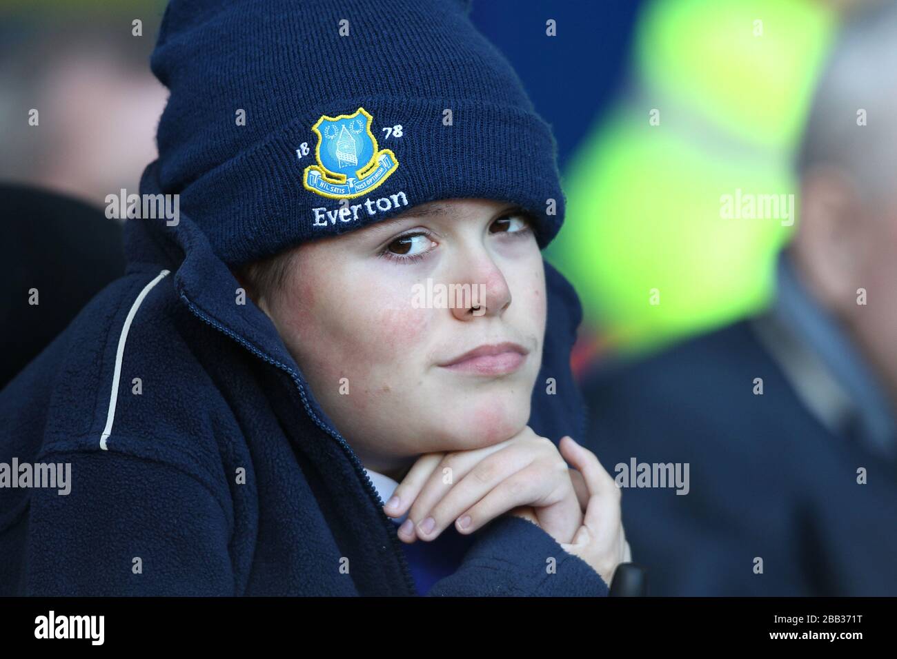 A young Everton fan in the stands Stock Photo