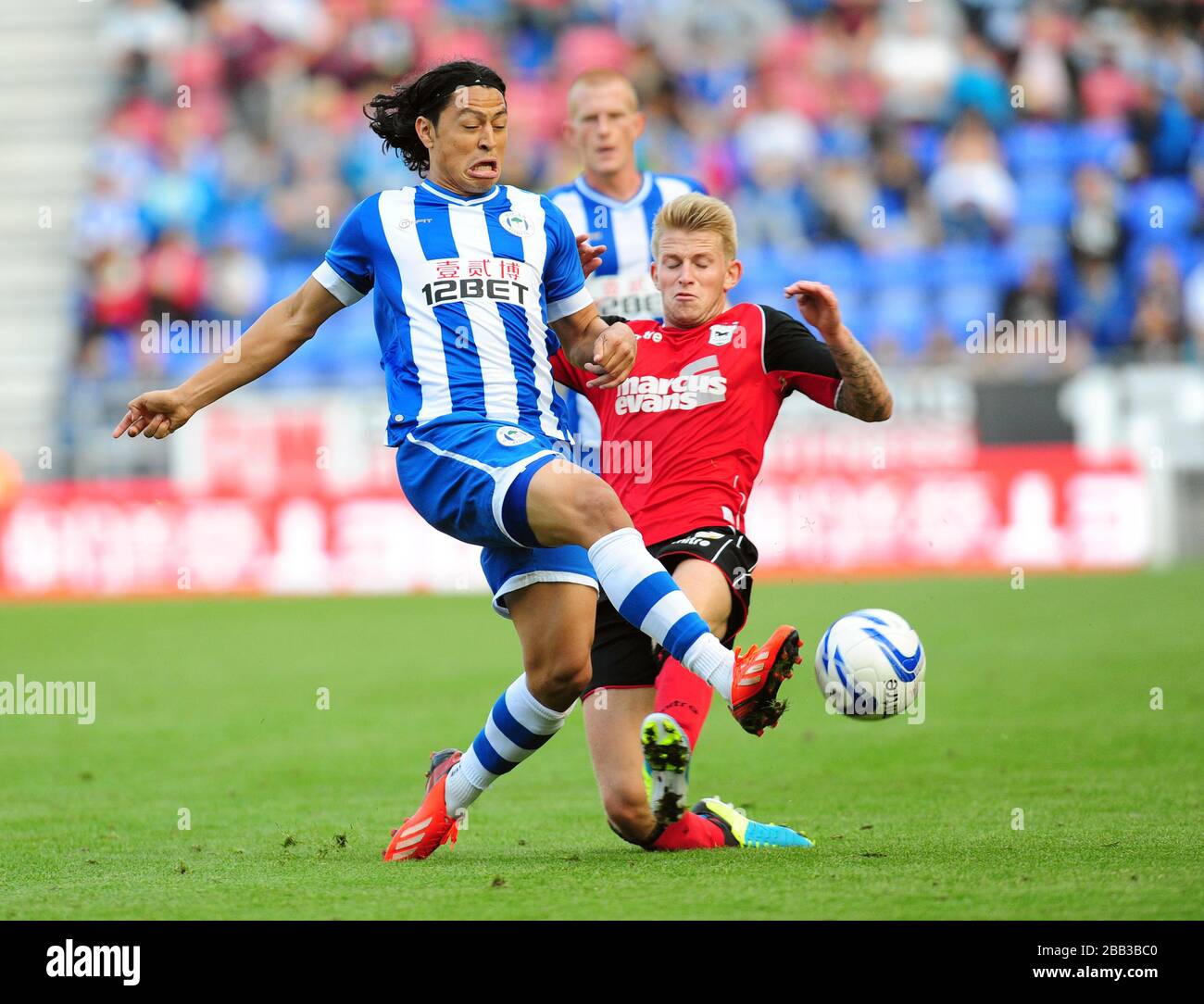 Wigan Athletic's Roger Espinoza (left) and Ipswich Town's Luke Hyam battle for the ball Stock Photo