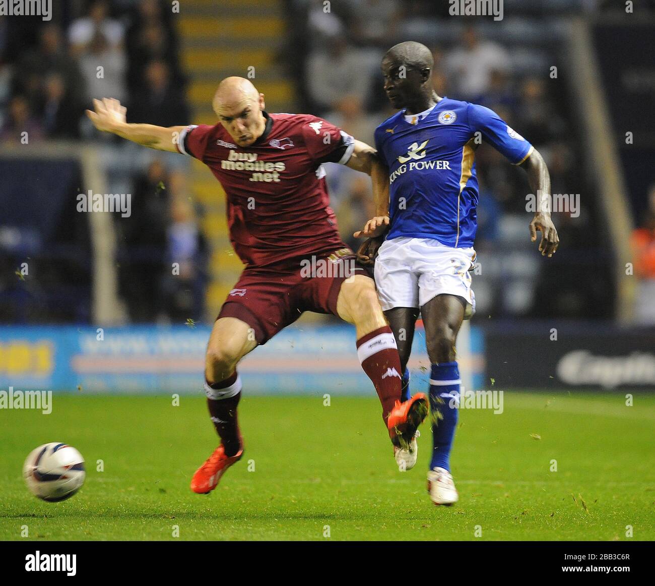 Leicester City's Zoumana Bakayogo (right) and Derby County's Conor Sammon (left) battle for the ball. Stock Photo