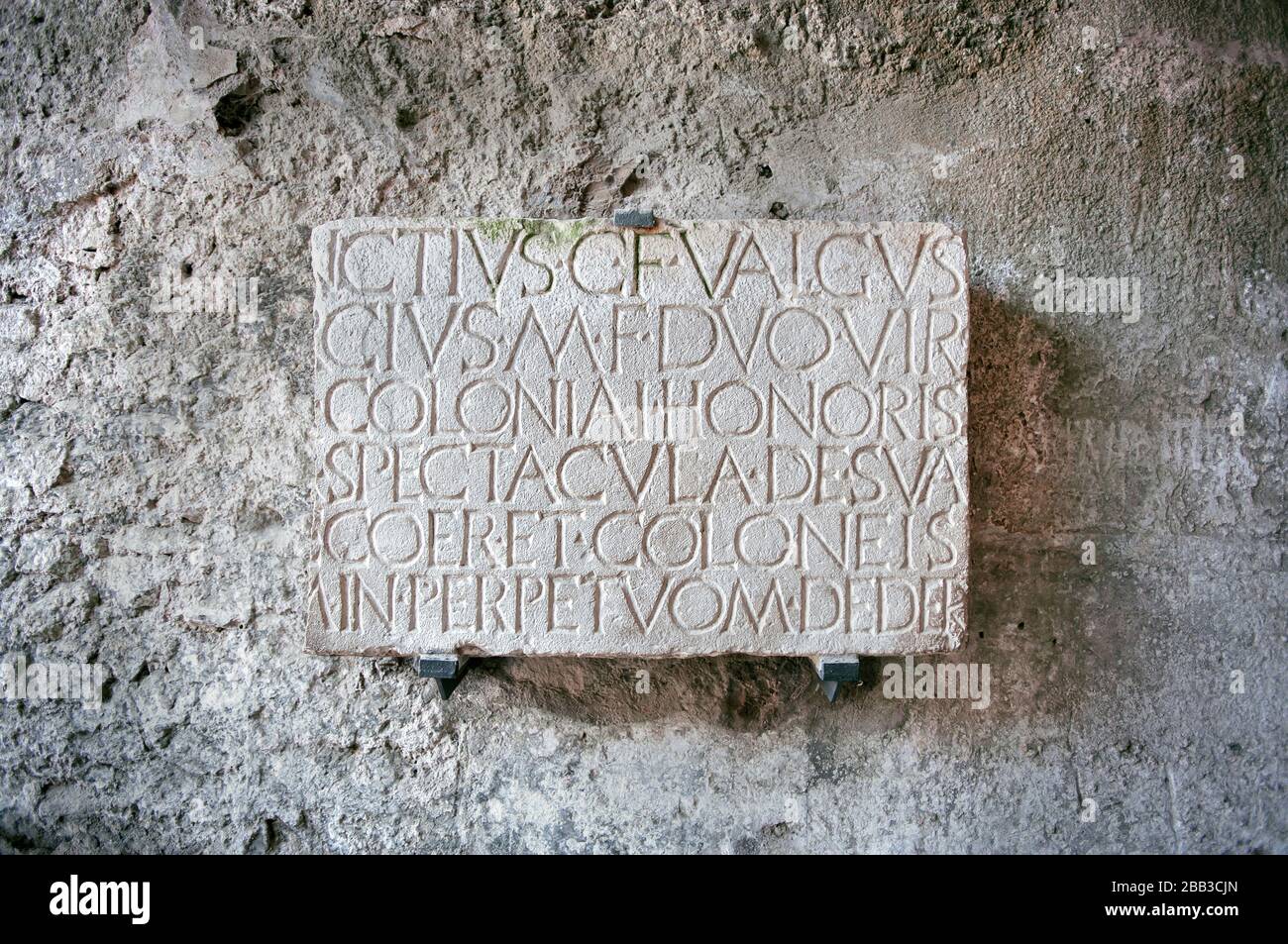 Roman inscription at the entrance to the amphitheater in the ancient city of Pompeii, Italy Stock Photo