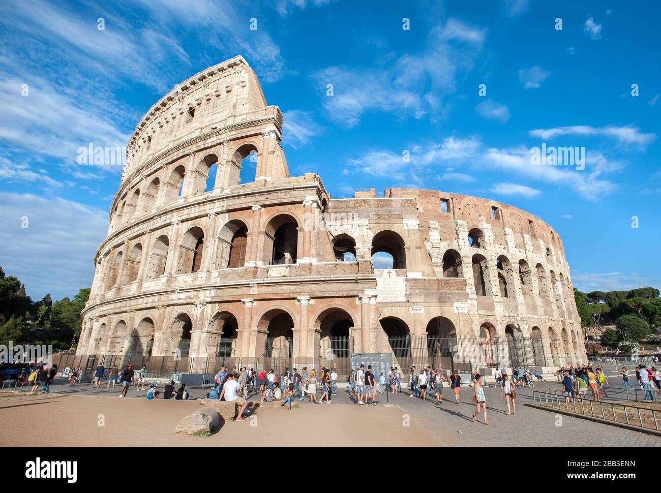 Tourists mill around outside the Colosseum in Rome Stock Photo