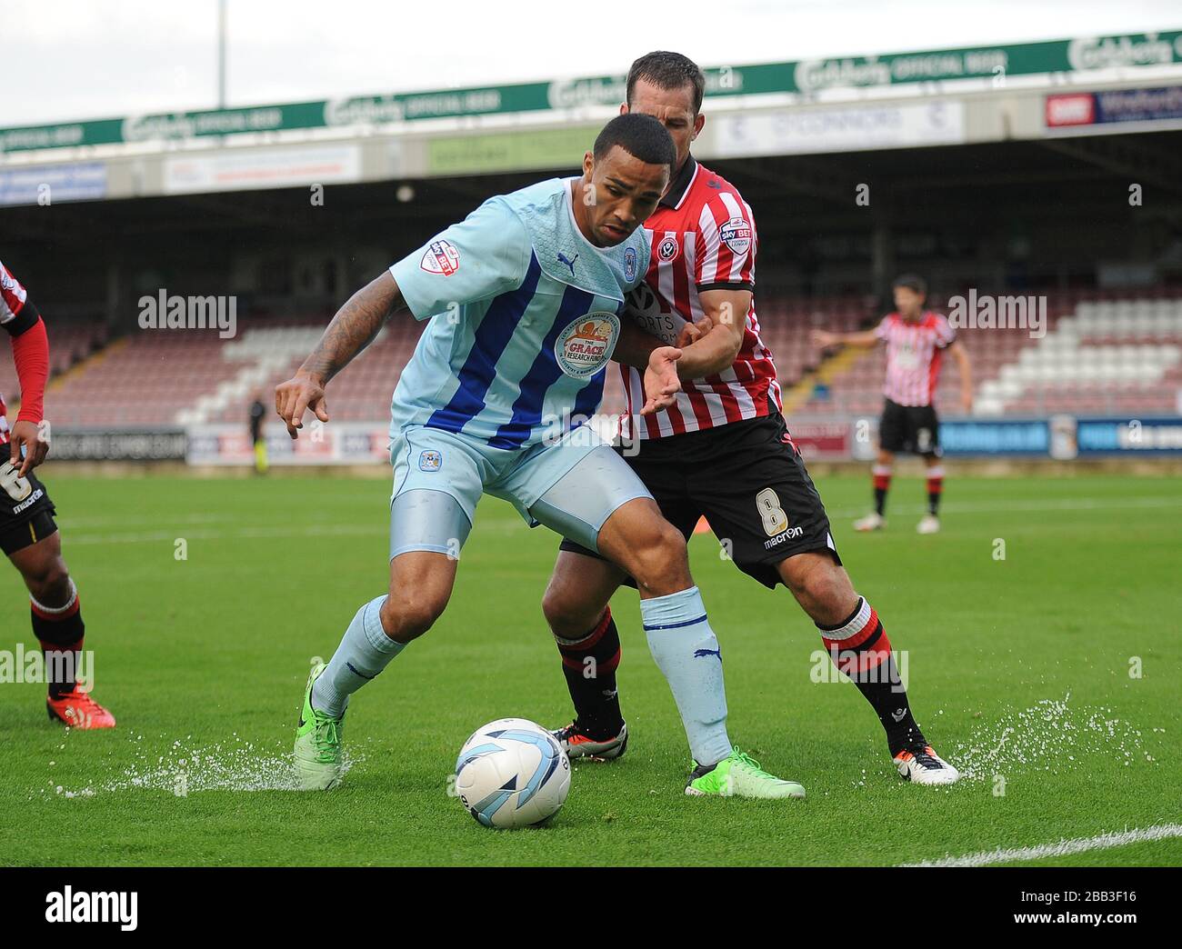 Coventry City's Callum Wilson holds off Sheffield United's Michael Doyle. Stock Photo