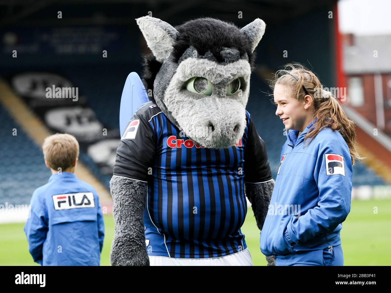 The Rochdale mascot interacts with young fans Stock Photo Alamy
