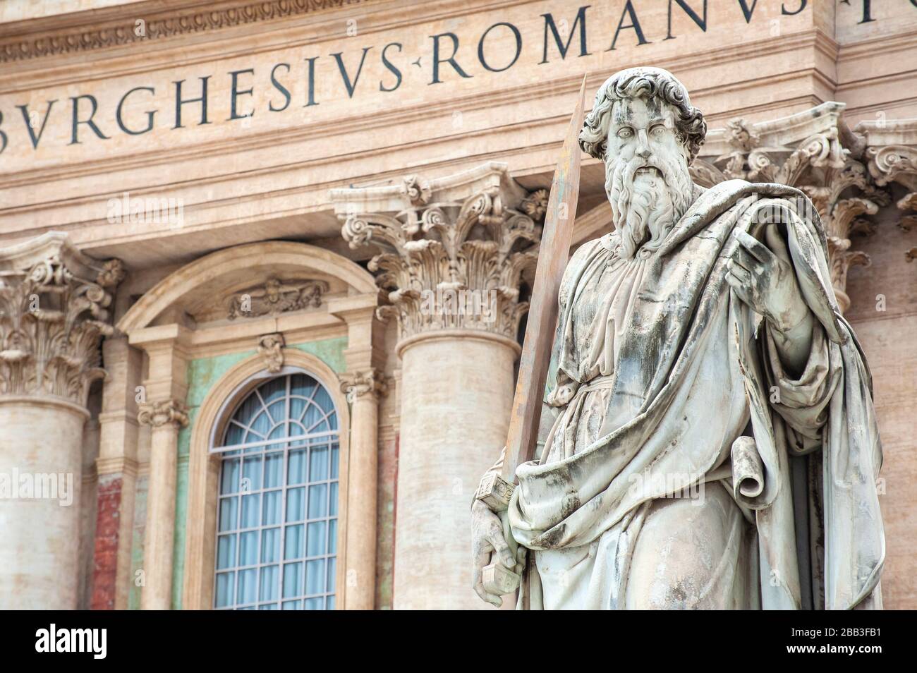 Statue of St. Paul standing in front of St. Peter's Basilica, St. Peter's Square, Vatican City, Rome Stock Photo