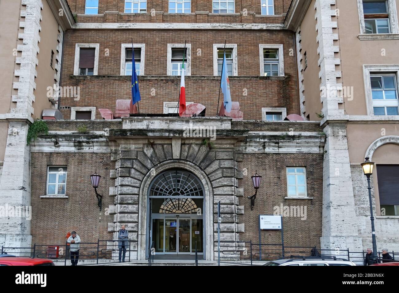 Holy Spirit Hospital entrance with sign. Evening view of facade of Ospedale Santo Spirito in Holy Spirit Hospital entrance with sign. Evening view of facade of Ospedale Santo Spirito in