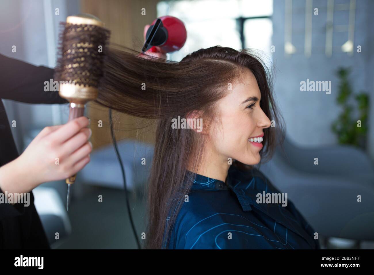Hairdresser and client at hair salon Stock Photo - Alamy