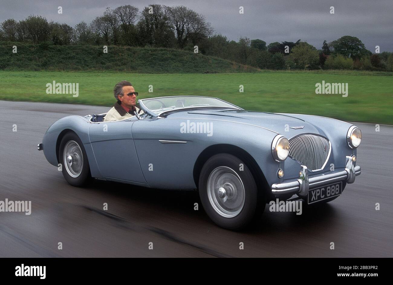 1956 Austin Healey 100M driving at speed. Stock Photo