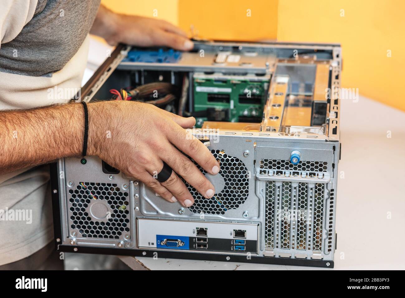 Technician repairing the computer. Concept of computer hardware, repairing, upgrade and