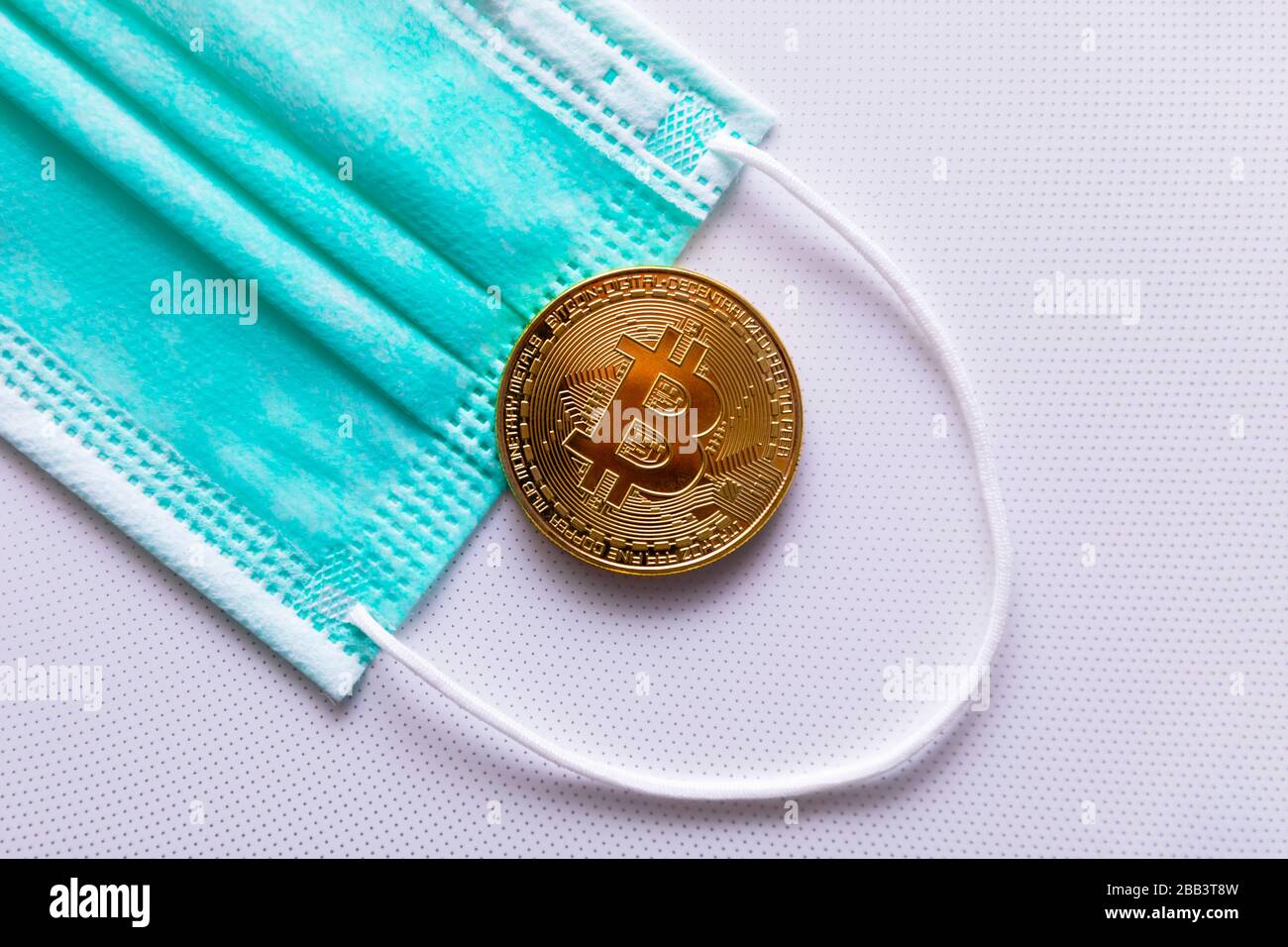 Protective medical mask and bitcoin close-up. The concept of the effect of  coronavirus on cryptocurrency Stock Photo - Alamy