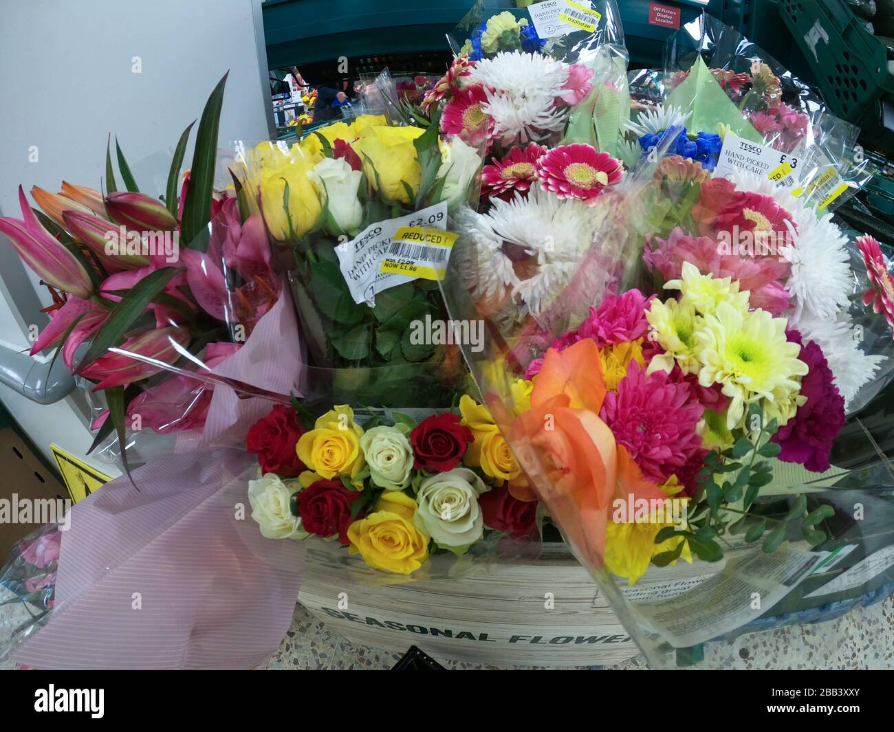 Reduced price flowers in Tesco supermarket. Unwanted flower bouquets in  shop during coronavirus crisis Stock Photo - Alamy
