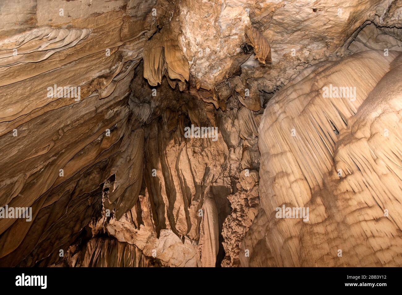 Amazingly shaped calcite deposits, speleothems, created by drippling water at the cave wall, Lang Cave, Gunung Mulu National Park, Sarawak, Borneo, Stock Photo