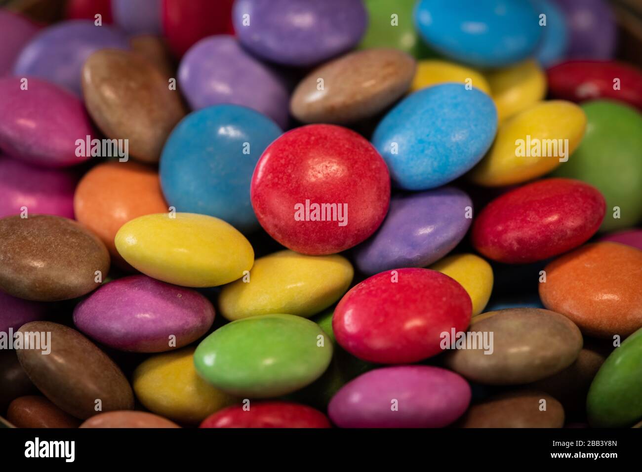 Multicolor candies on wooden hi-res stock photography and images - Alamy