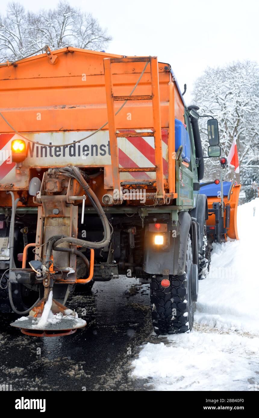 heavy road service truck in winter in german Winterdienst, translate winter service Stock Photo