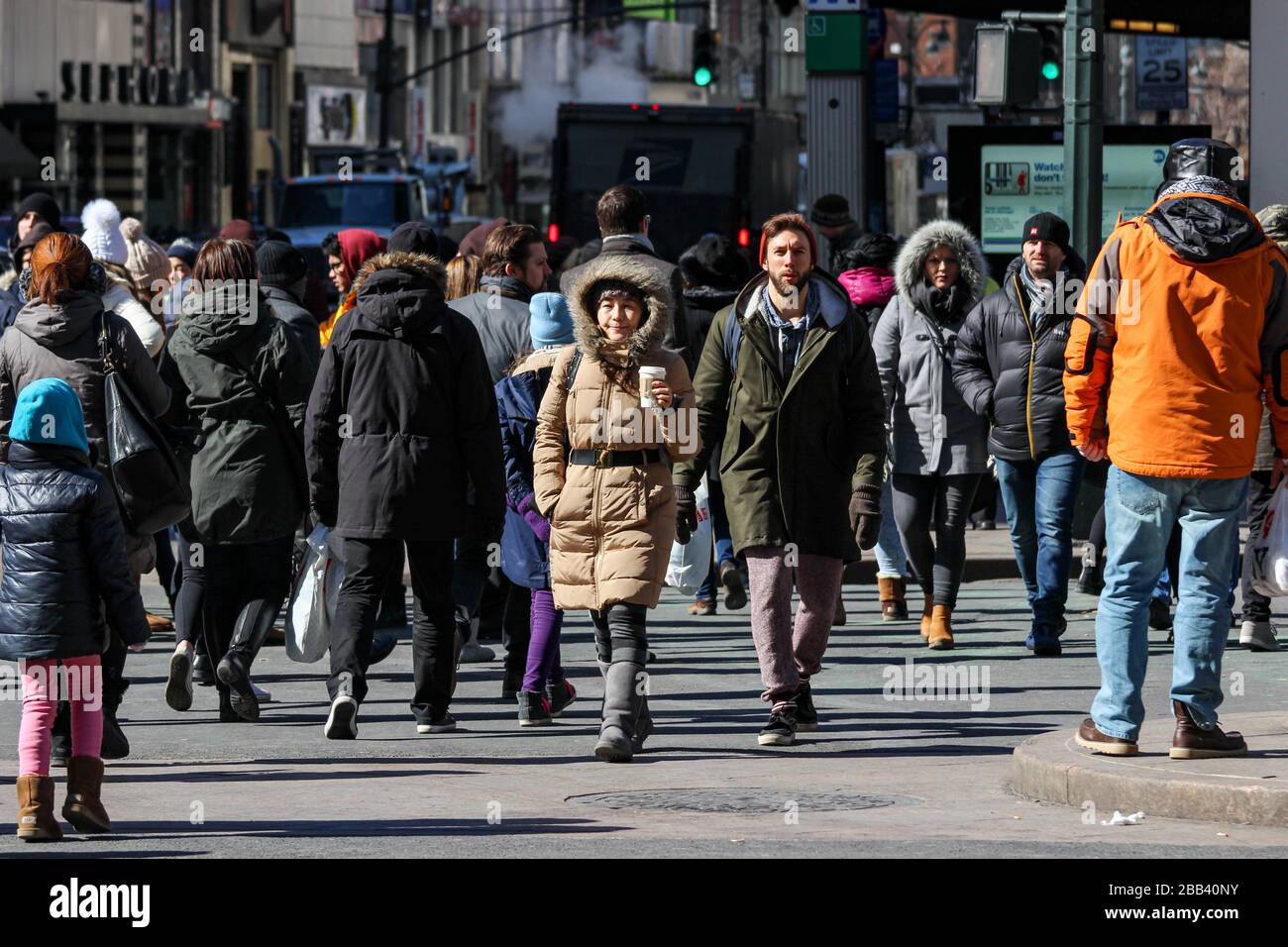Street view of people in winter clothes in Manhattan, New York City
