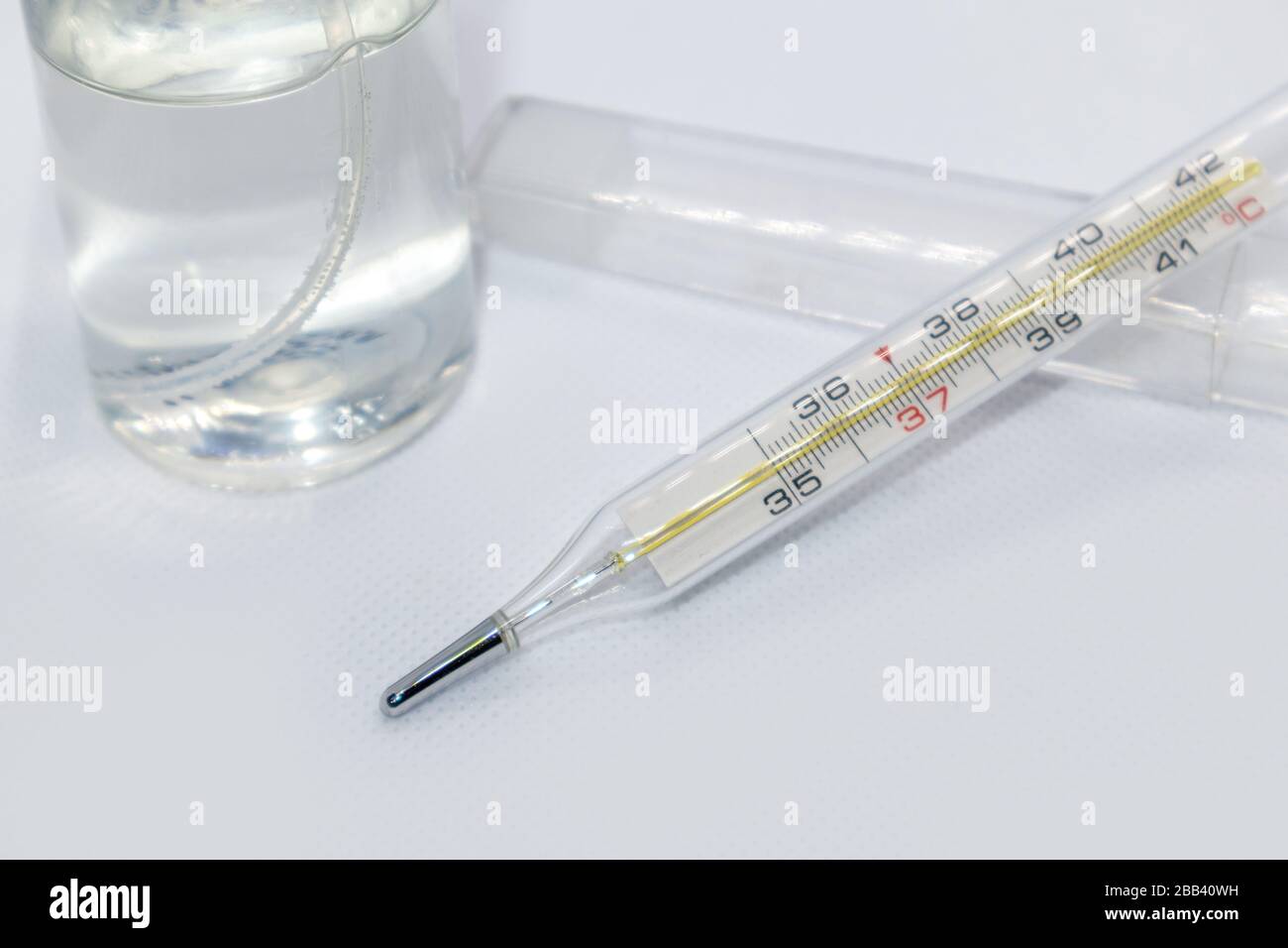 Thermometer macro, mercury instrument, measuring, indicating temperature medical equipment tool on white background Stock Photo