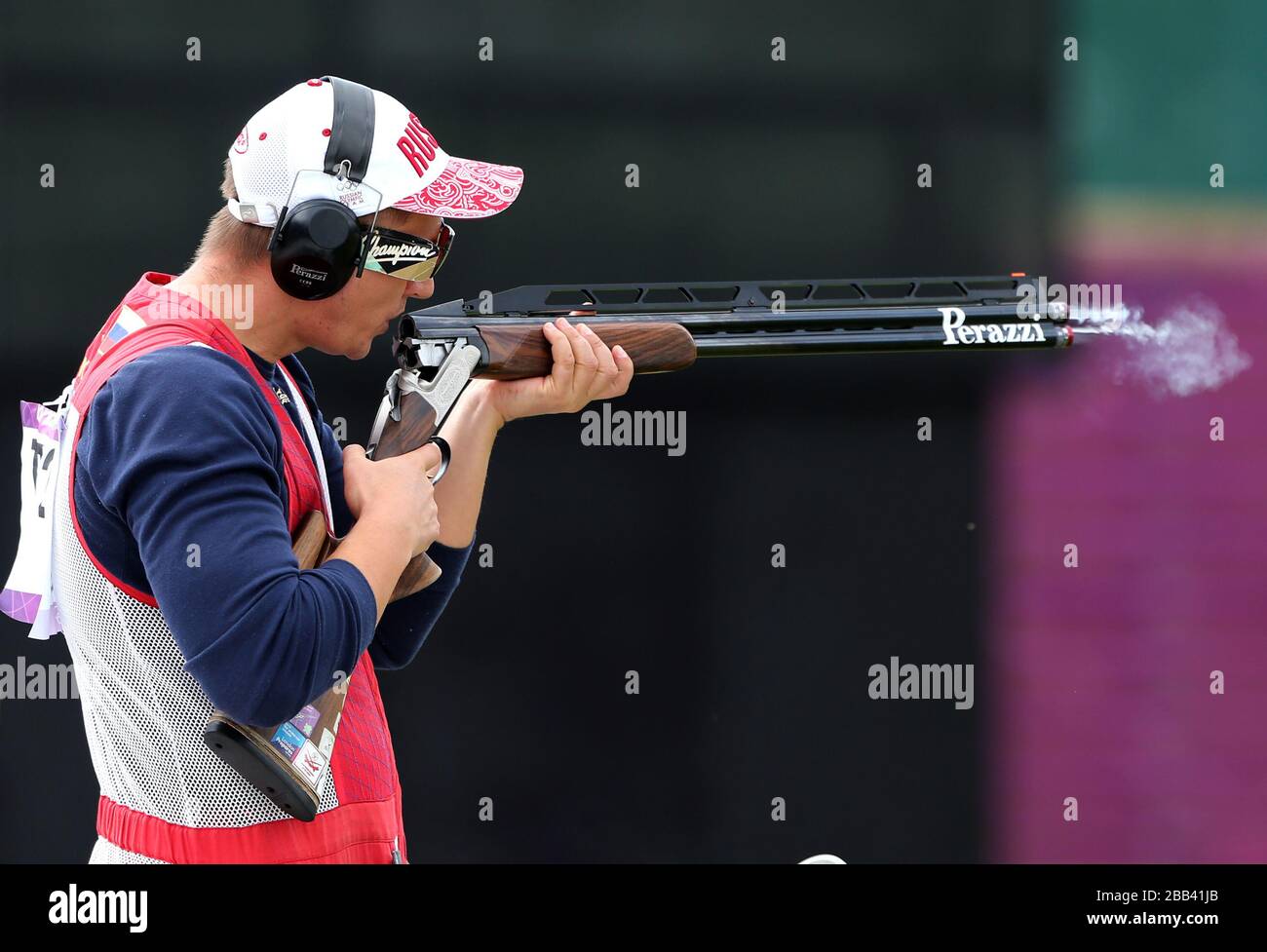 Russia's Vasily Mosin blows smoke from his shotgun during his Double ...