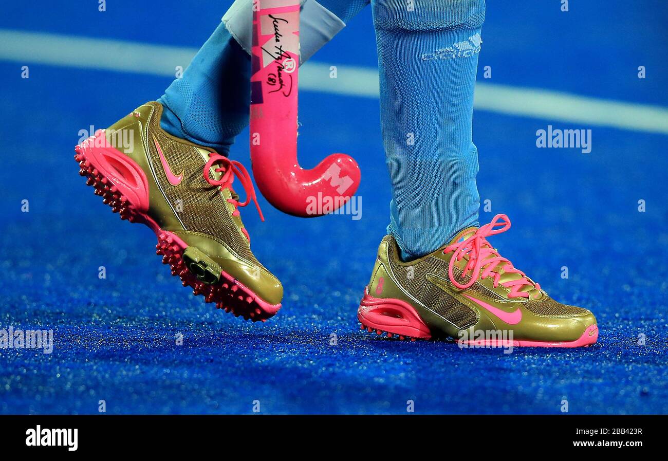 Argentina's Luciana Aymar wears golden shoes and a stick bearing her name  against New Zealand in the Preliminary Round Group B Hockey match at the  Riverbank Arena in the Olympic Park on