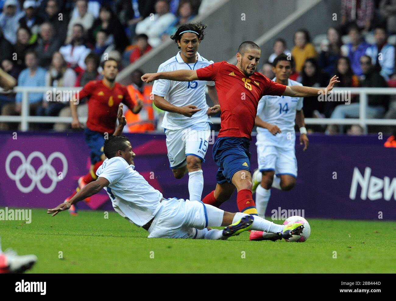 Spain's Isco is tackled by Honduras' Luis Garrido during the Group D match at St James' Park, Newcastle Stock Photo