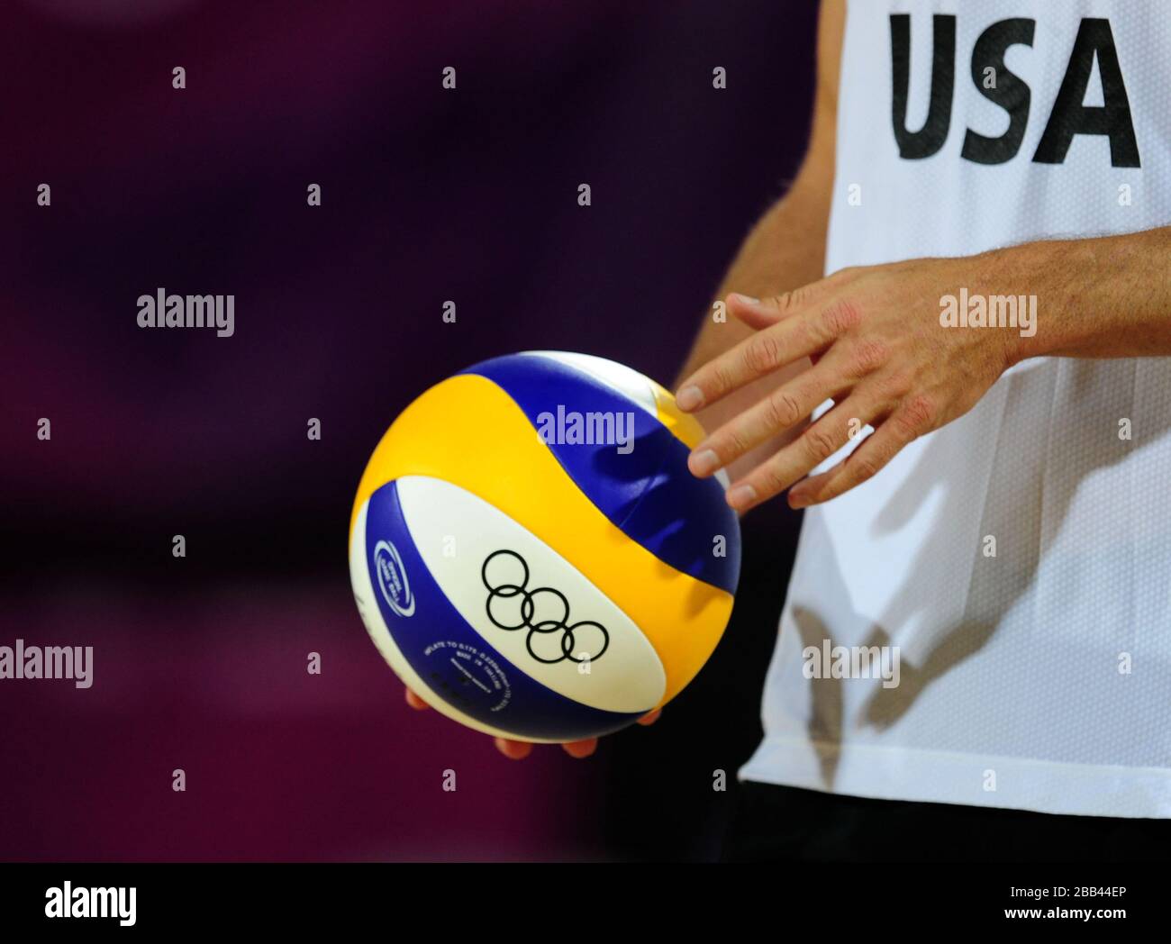 USA's Jacob Gibb waits to take his serve in the Men's Beach Volleyball Preliminary Phase at Horse Guards Parade, London Stock Photo