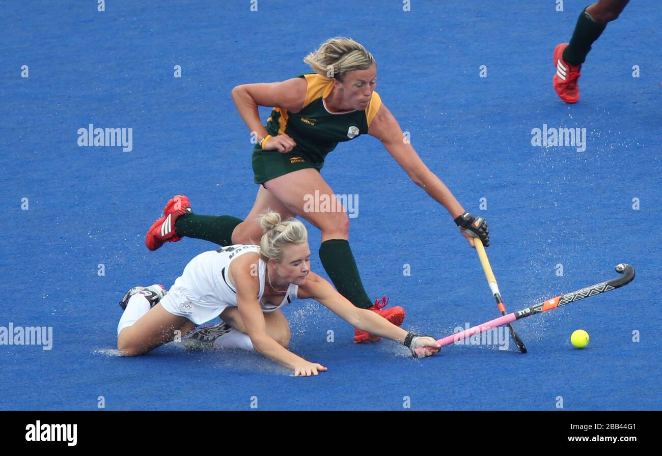 New Zealand's Charlotte Harrison tackles South Africa's Tarryn Bright during the Pool B match at the Hockey Centre, London. Stock Photo