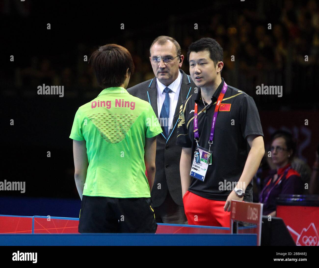 China's Ning Ding is upset about a decision by the umpire in her Gold ...