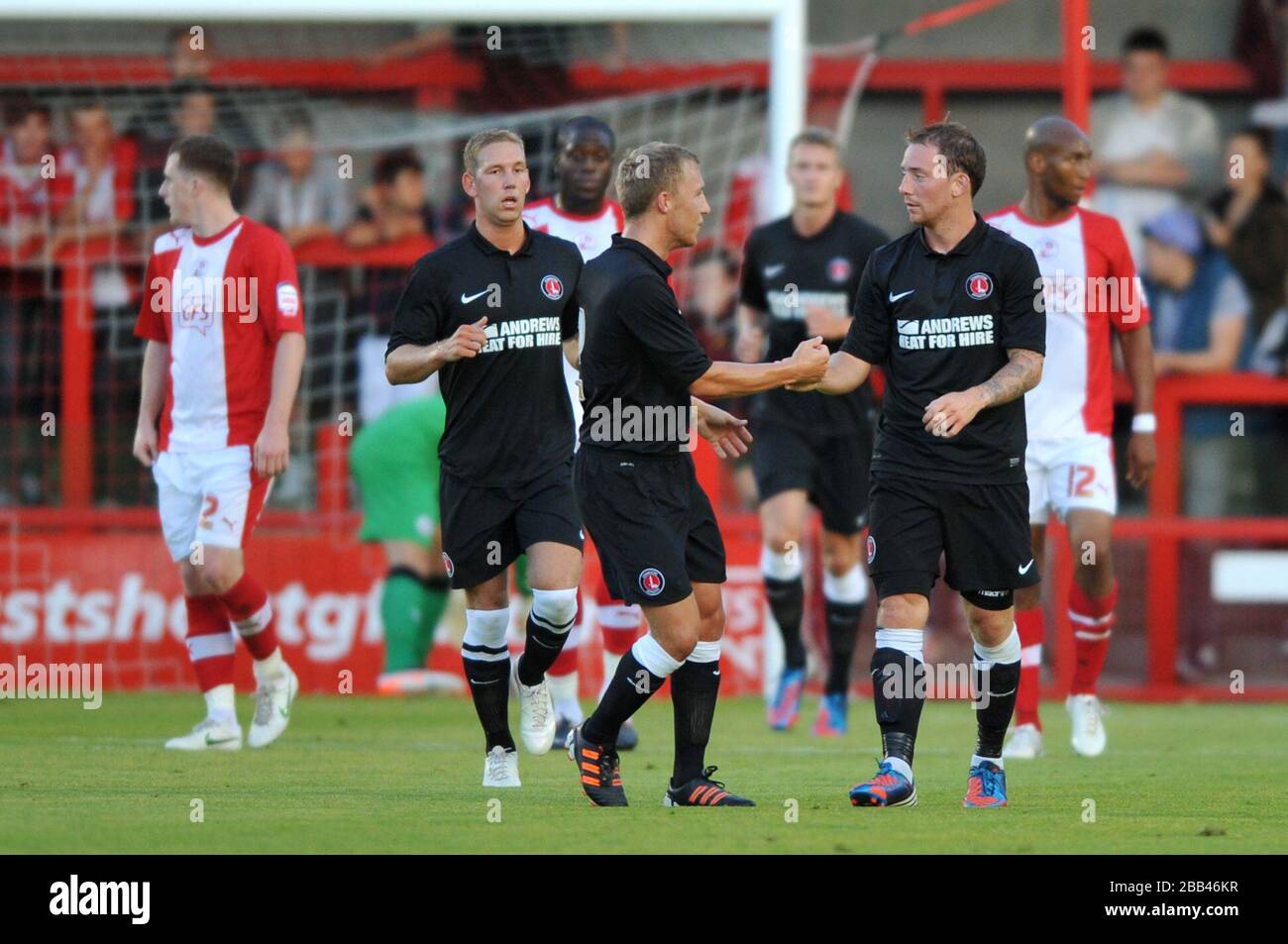 Danny Green of Charlton Athletic (right) celebrates his goal during the friendly match at the Broadfield Stadium, Crawley Stock Photo