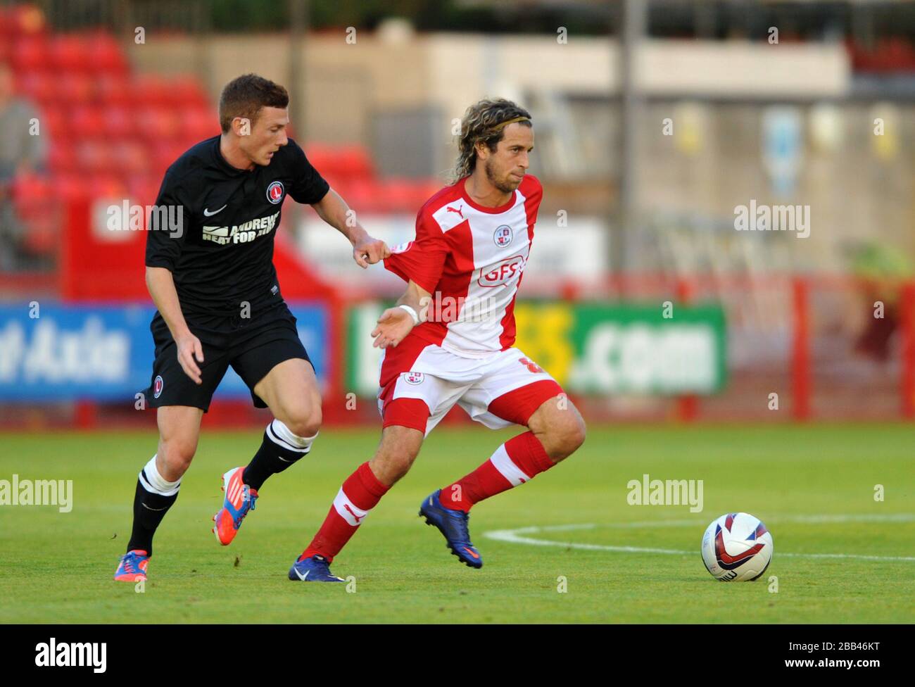 Crawley Town's Sergio Torres and Charlton Athletics Rhoys Wiggins during the friendly match at the Broadfield Stadium, Crawley Stock Photo