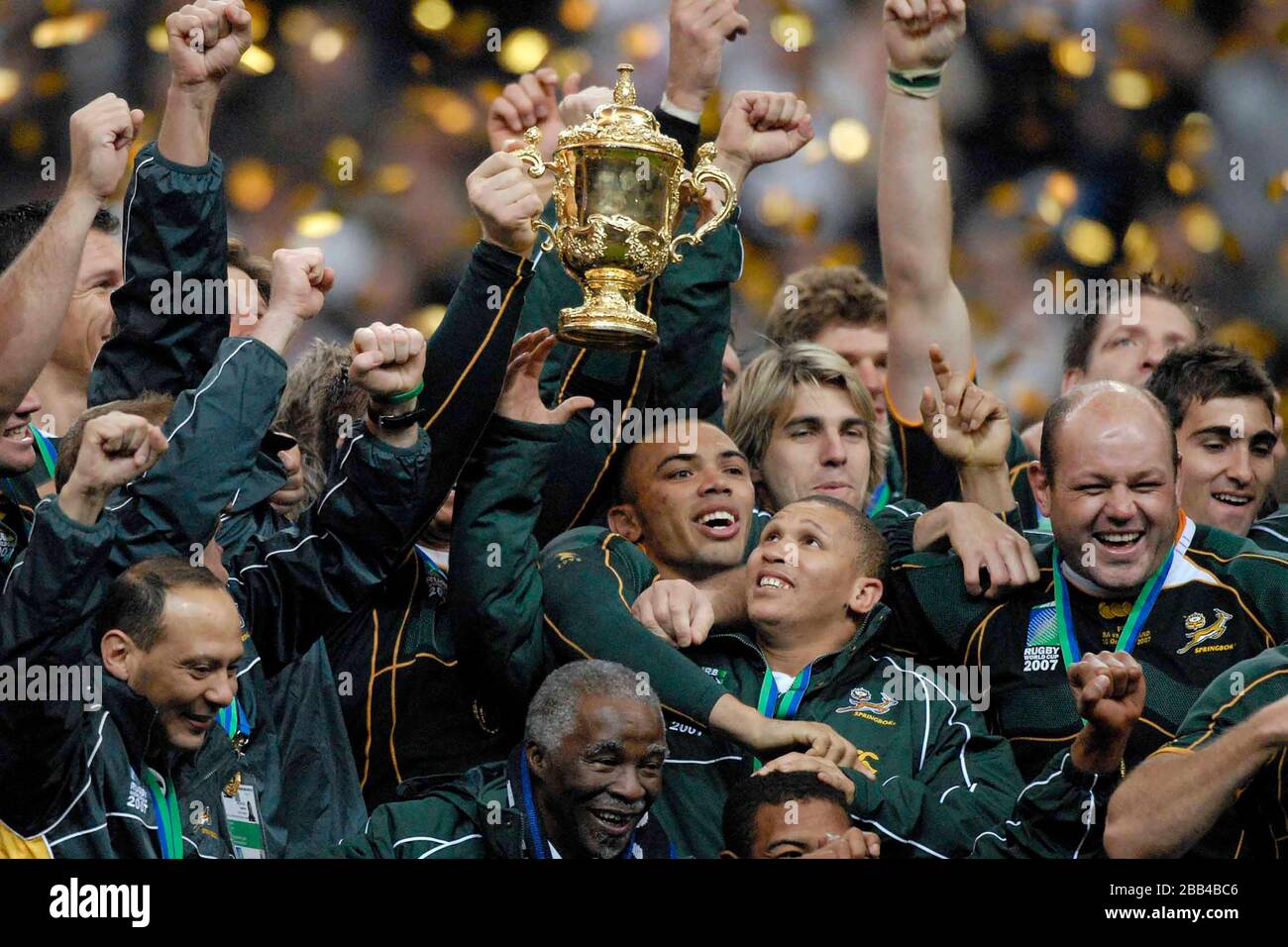 The Webb Ellis Trophy is held aloft by the South African team. The South African President, Thabo Mvuyelwa Mbeki, is at the bottom centre. (Bryan Haba Stock Photo