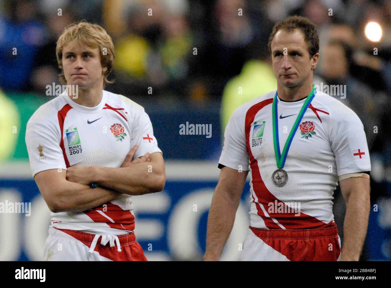 A dejected Mathew Tait (England, left) and Mike Catt )England, right) watch the trophy presentation to South Africa