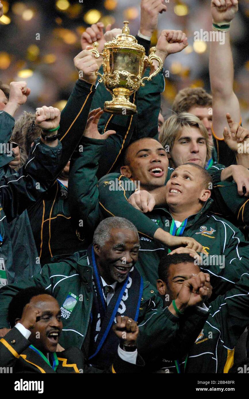 The Webb Ellis Trophy is held aloft by the South African team. The South African President, Thabo Mvuyelwa Mbeki, is at the bottom centre. (Bryan Haba Stock Photo
